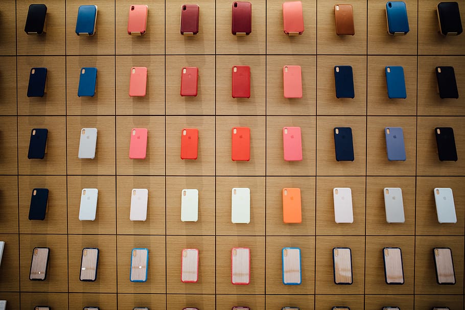 assorted-color iPhone cases, in a row, indoors, full frame, order HD wallpaper