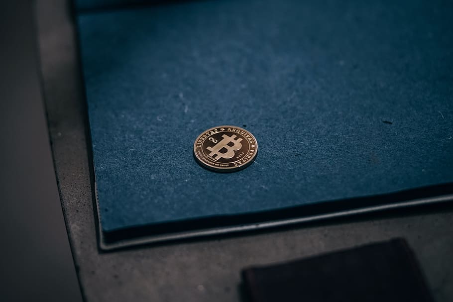 Gold-Plated Bitcoin Against a Blue Draft Board. Grungy Texture Blue Draft Board. HD wallpaper