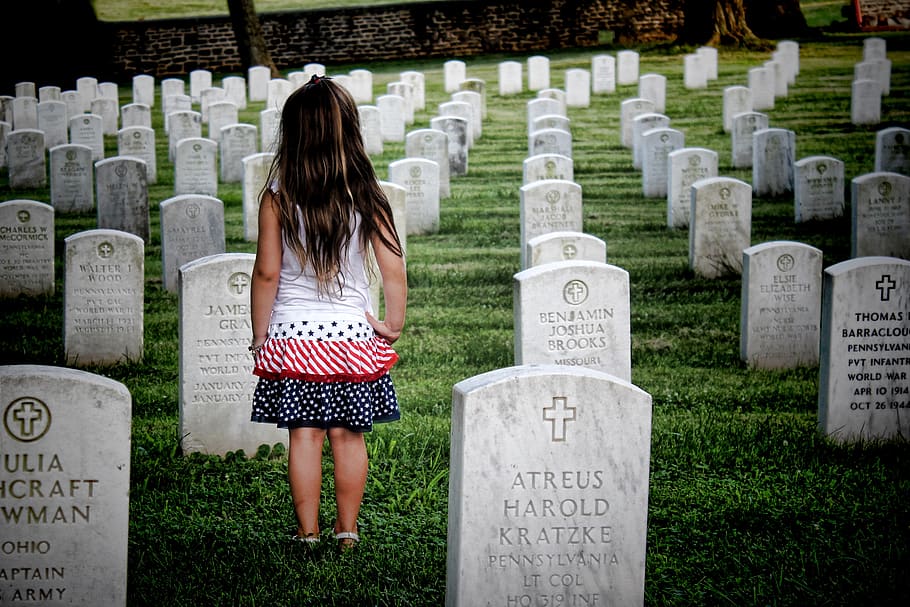 Girl Surrounded by Gravestones, army, back view, burial, cemetery