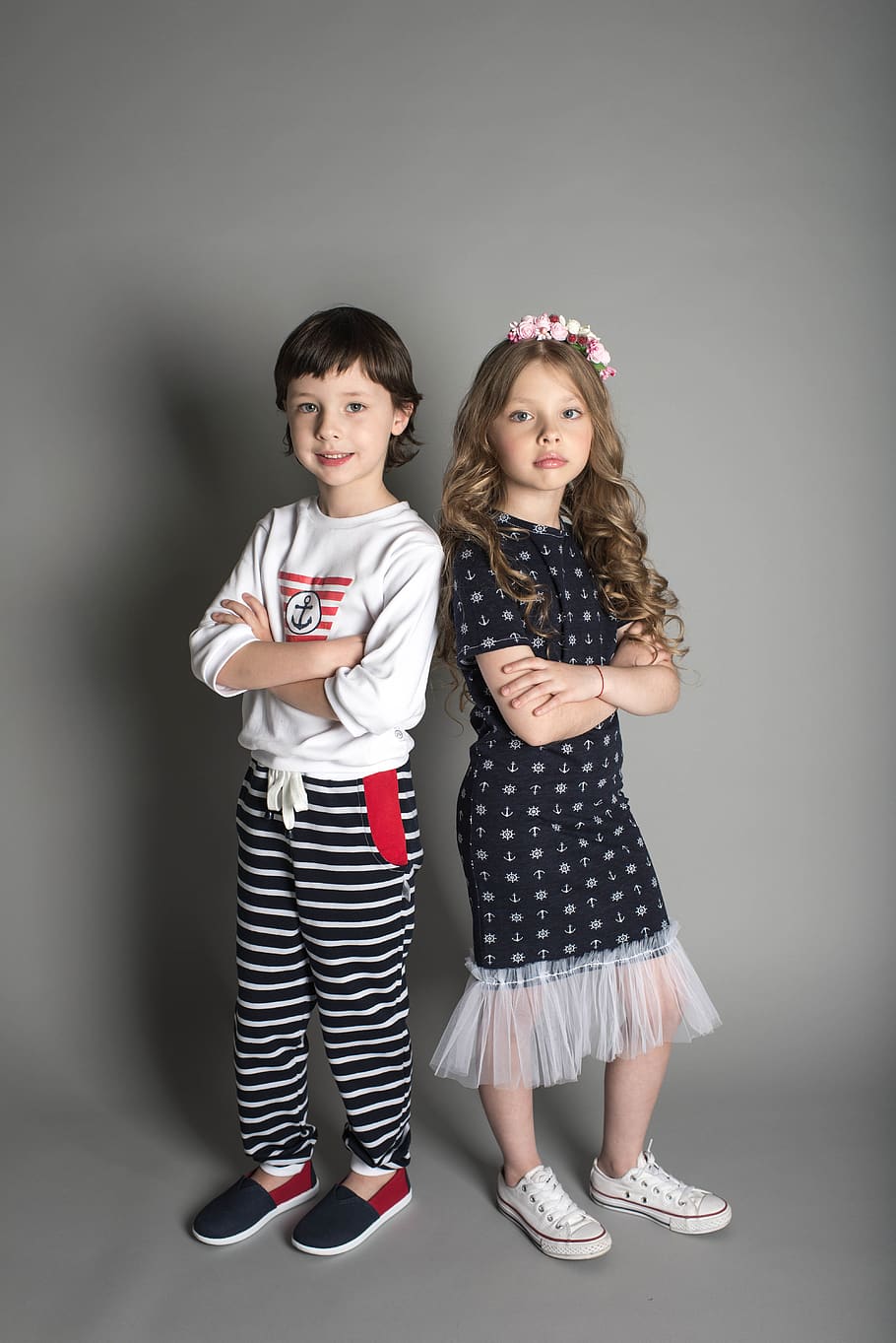 Two Children Standing While Crossing Their Arms, arms crossed