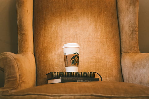 white Starbuck plastic cup on brown fabric armchair, coffee, book HD wallpaper