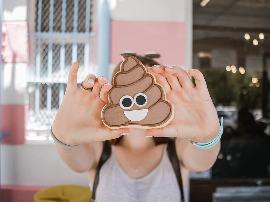 woman holding poop case, human, person, charlies bakery, hand, HD wallpaper