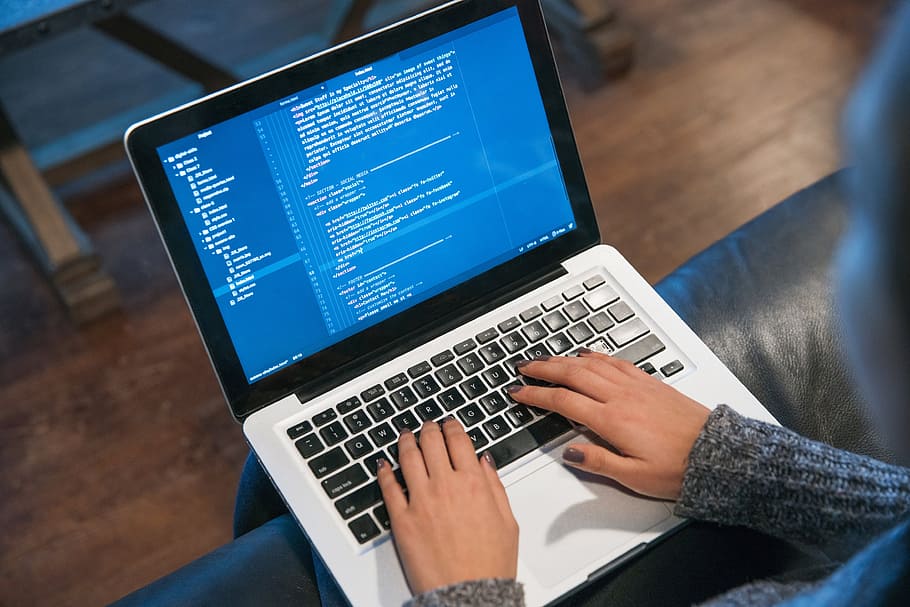 Programmers Hands Are Coding On A Laptop In The Dark With A View