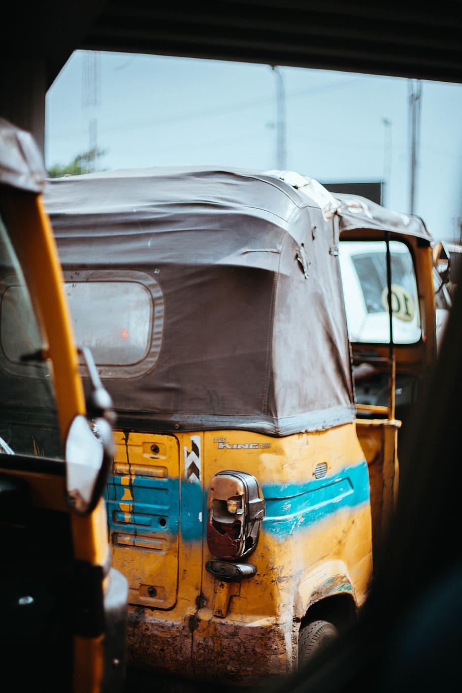 yellow auto-rickshaw, transportation, tire, vehicle, bus, van