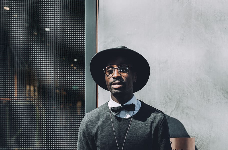 Man Wearing Hat and Bowtie in Front of Concrete Wall, bow tie HD wallpaper