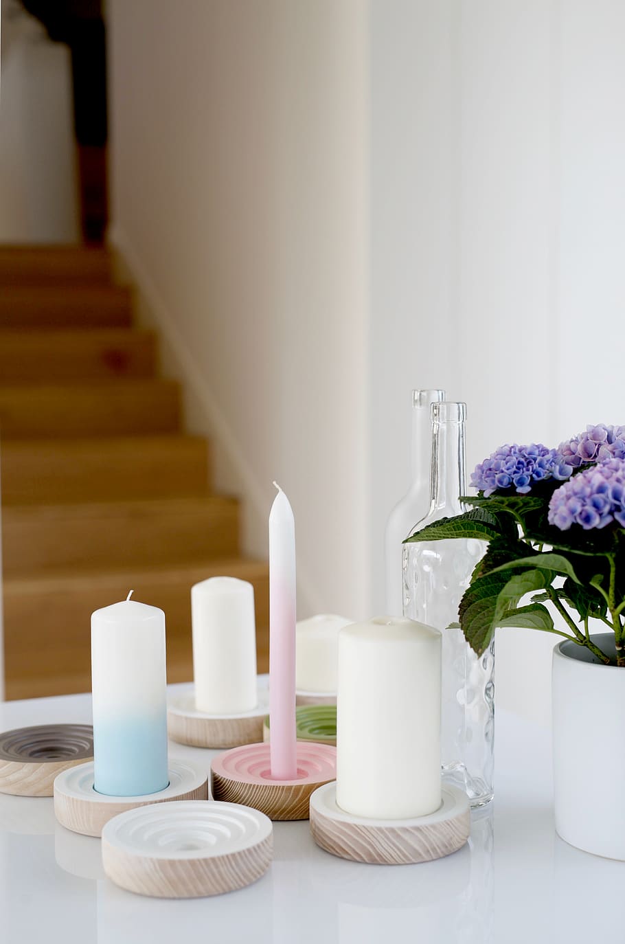 white pillar and candlesticks on white table, flower, indoors HD wallpaper