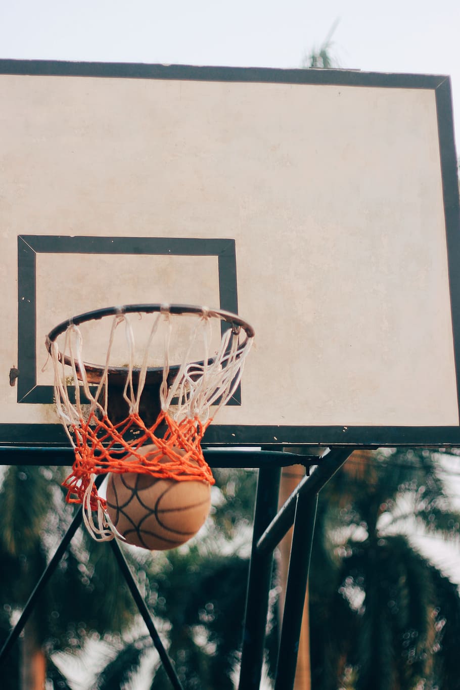 close-up photo of basketball rim during daytime, outdoors, street