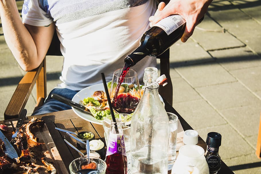 man sitting while pouring wine, bottle, human, person, drink HD wallpaper
