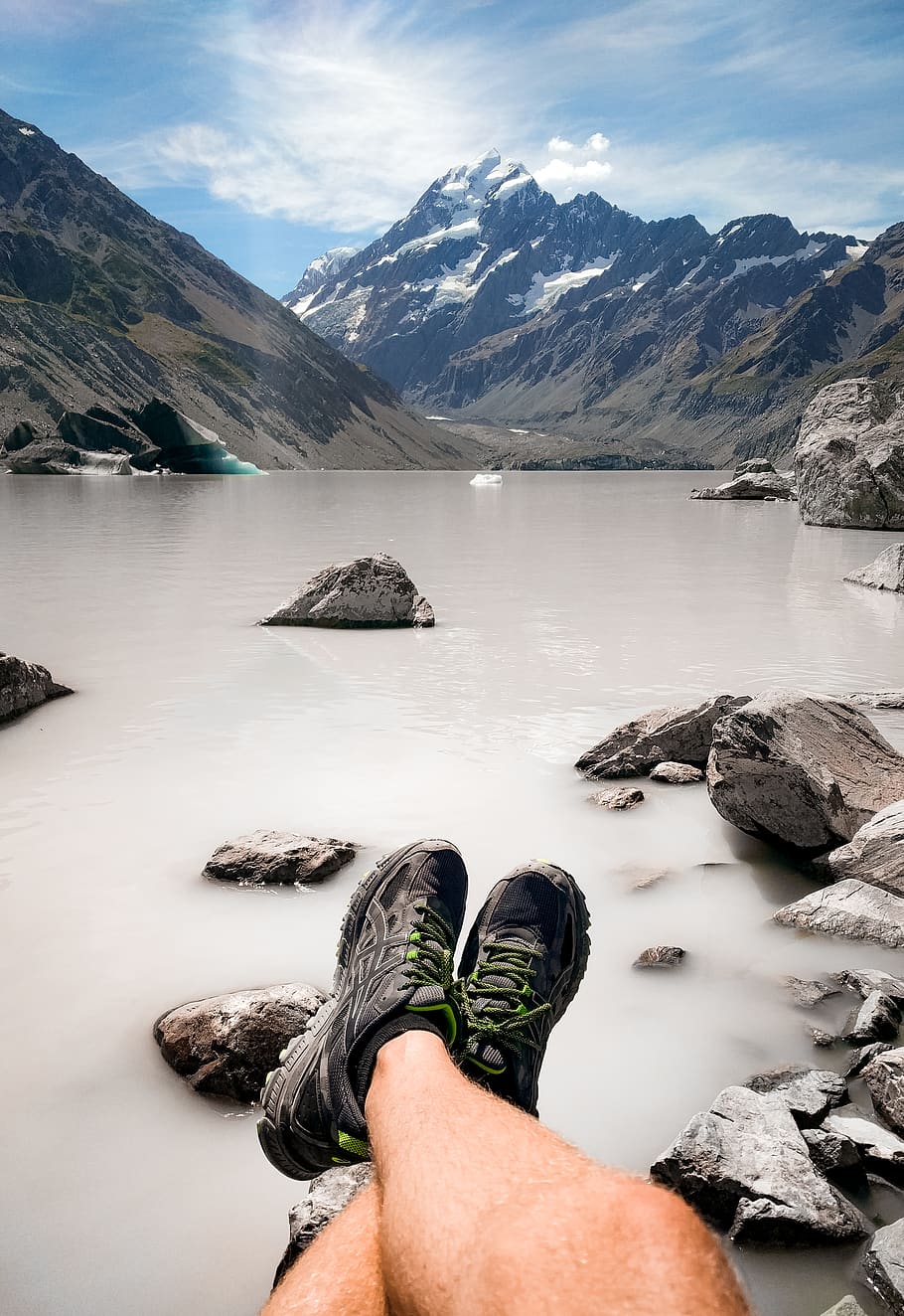Person Sitting On Rock Near Body Of Water And Mountain, adventure HD wallpaper