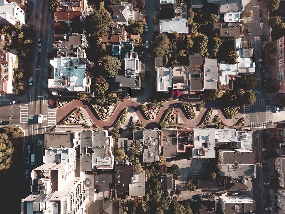 aerial photography of buildings near road, neighborhood, town
