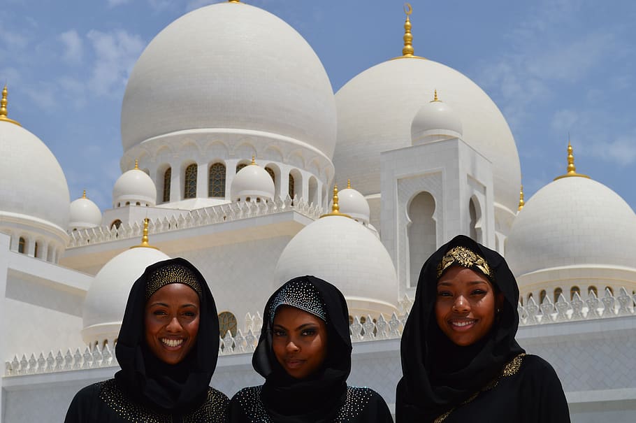 Three Women Taking A Photo In Front Of White Mosque, architecture
