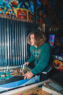 man playing pinball machine, person, human, arcade game machine HD wallpaper