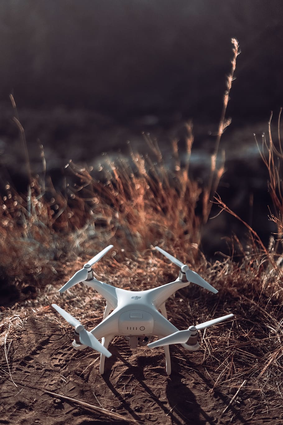 White Quadcopter Drone on Land, close-up, daylight, grass, landscape HD wallpaper