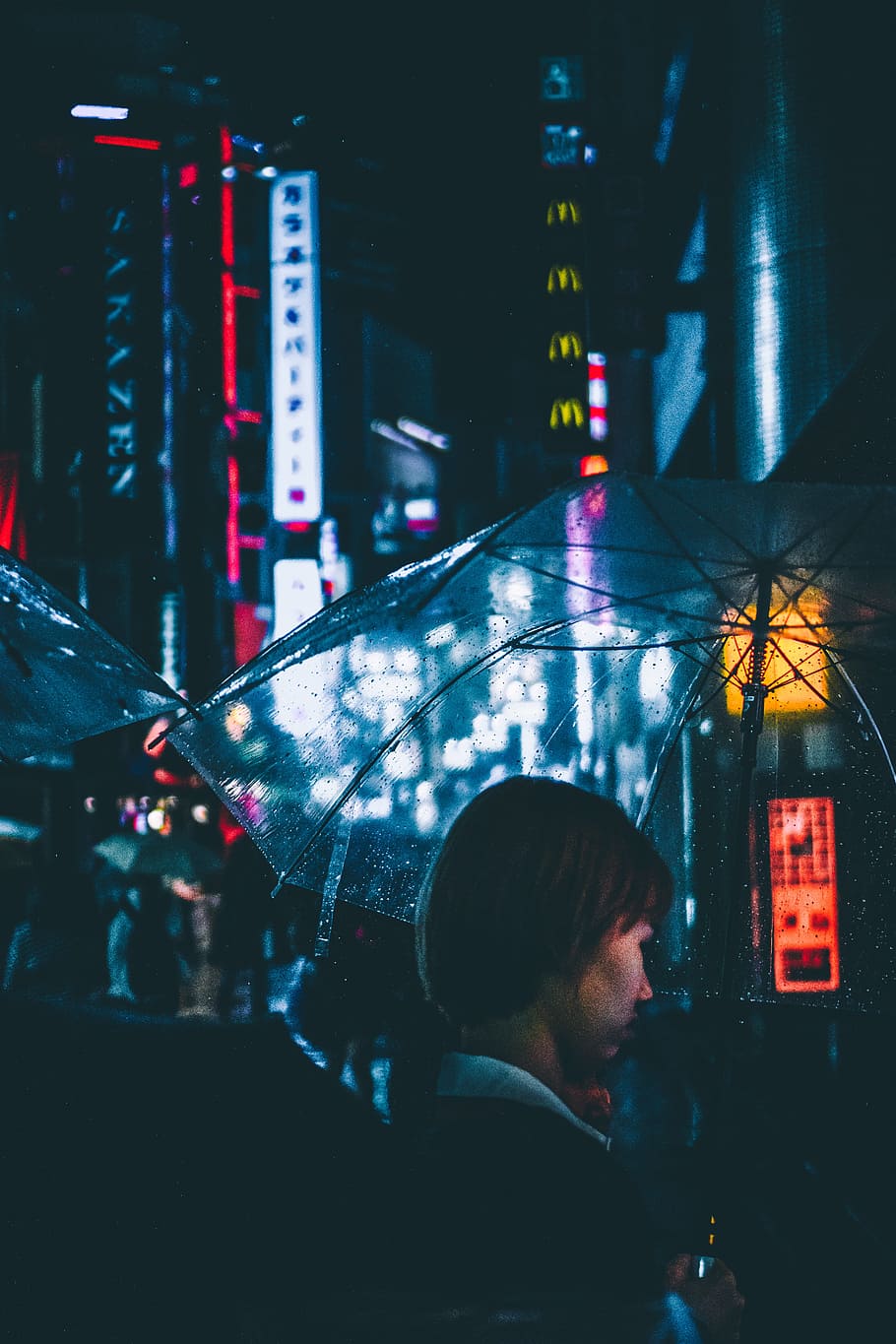 woman holding umbrella, light, moody, rainy, grimey, dark, reflection