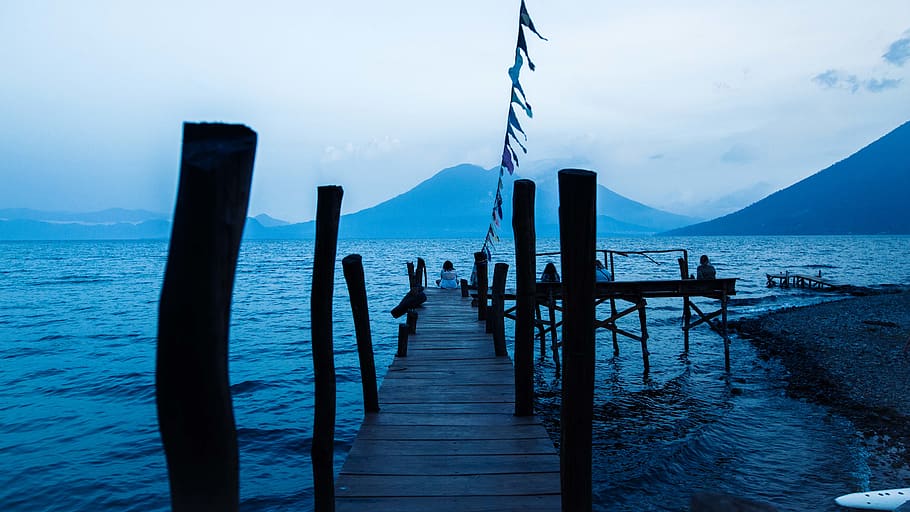 person sitting on brown docking pier, guatemala, lake atitlán HD wallpaper