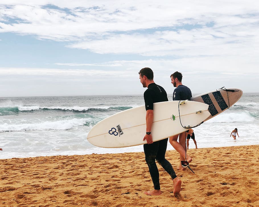 Two Men Carrying Surfboards Near Seashore, beach, enjoyment, fun
