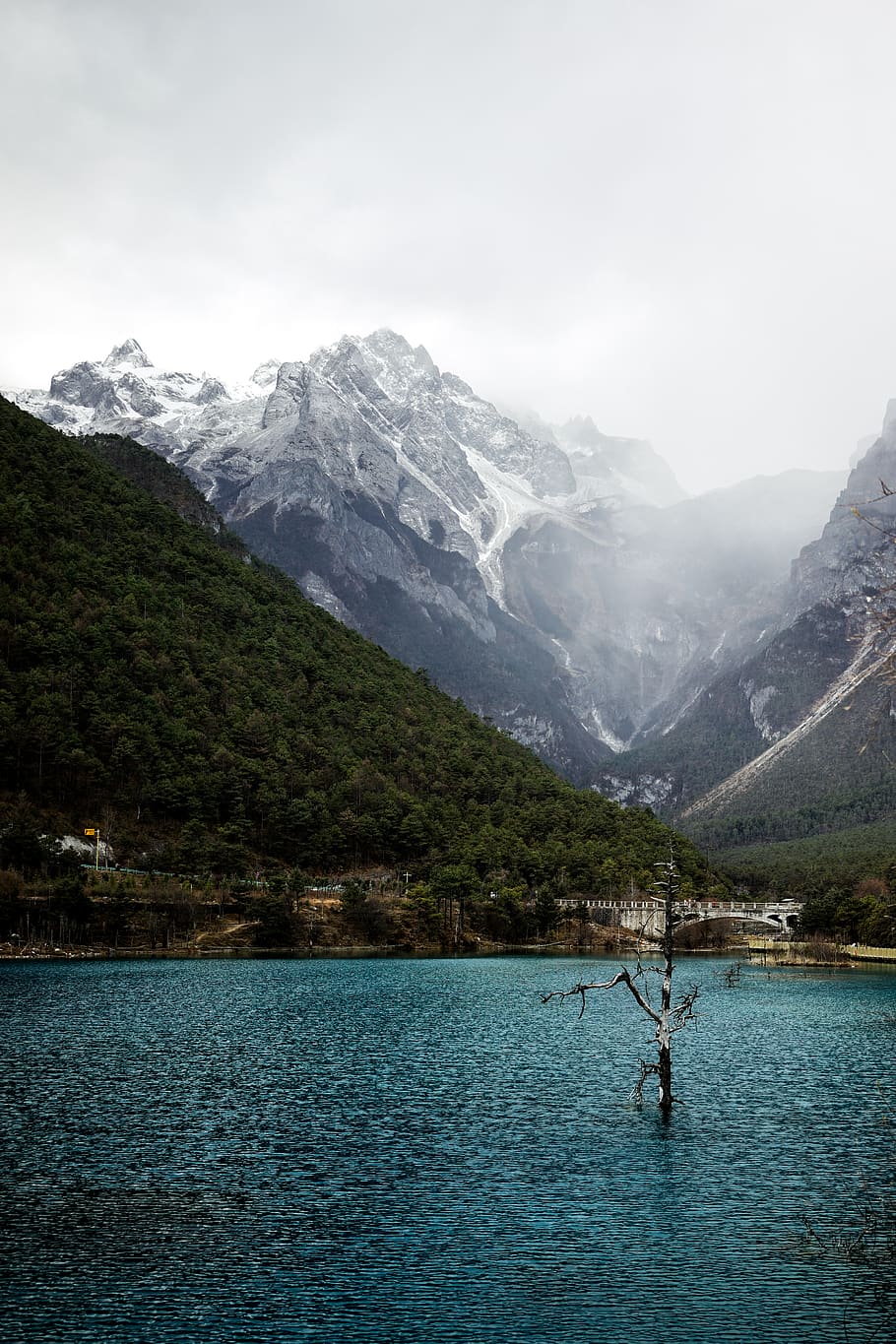 calm body of water and mountain during daytime, outdoors, nature