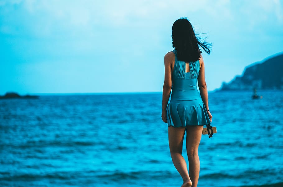 woman in blue midi dress standing near sea, apparel, clothing