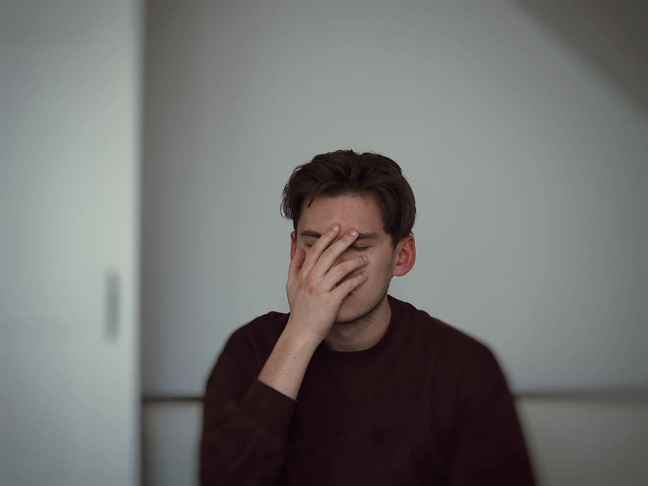 man covering his face, one person, real people, front view, wall - building feature HD wallpaper