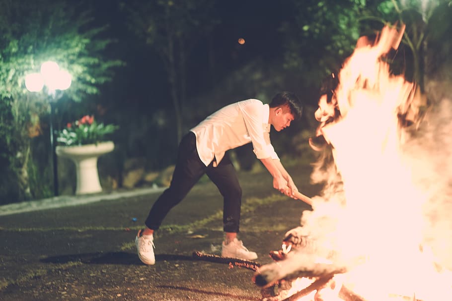 Man Beside Fire, burning, flame, hot, person, real people, fire - natural phenomenon HD wallpaper