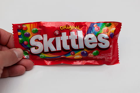 Skittles, colors, human hand, human body part, text, food, holding HD wallpaper