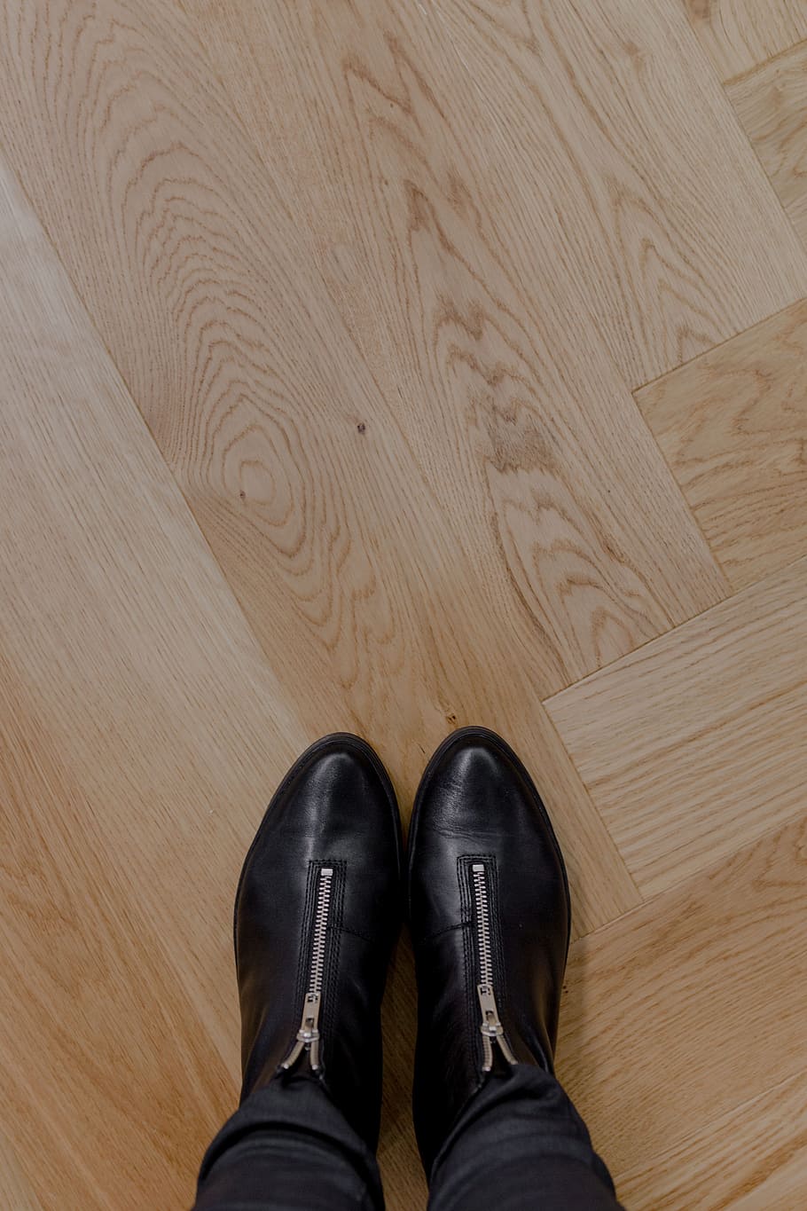 Beautiful oak floor, oak parquet, low section, shoe, human leg