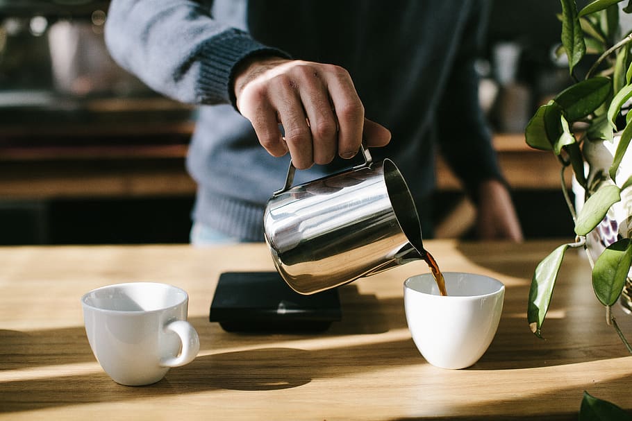 Person Pouring Coffee in White Ceramic Mug, beverage, caffeine HD wallpaper