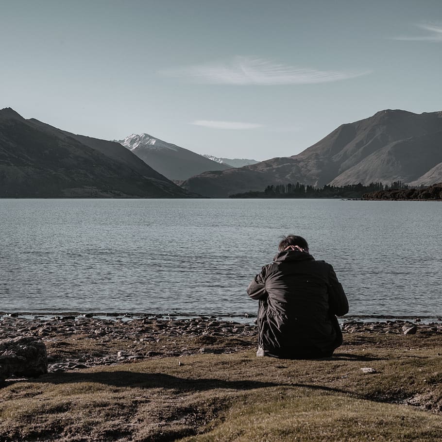 man wearing black jacket, mountain, water, scenics - nature, beauty in nature HD wallpaper