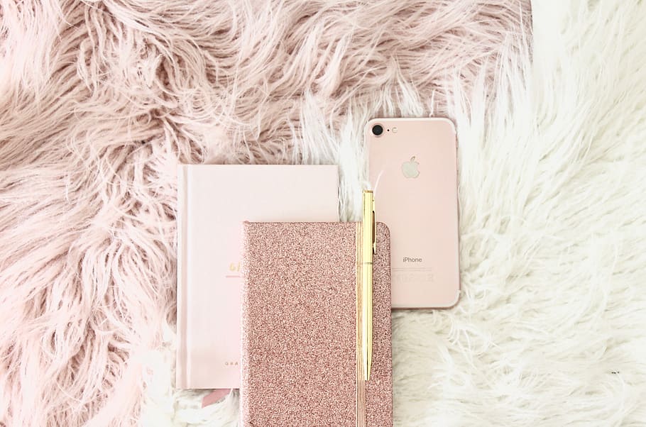 gold iPhone 8 beside book, mobile phone, cell phone, electronics HD wallpaper