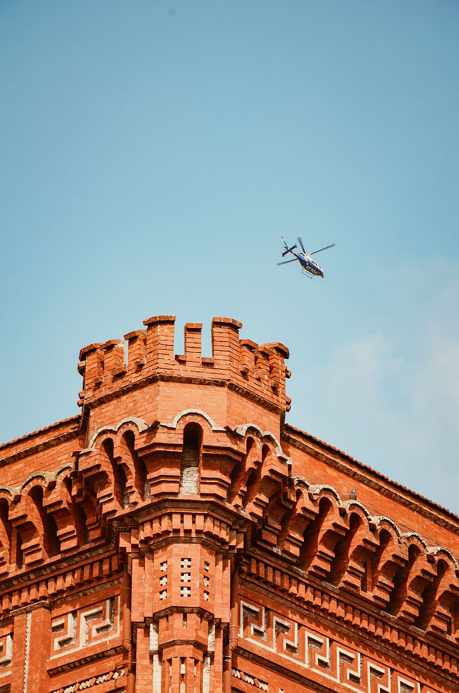 Helicopter Flying Over Brown Building With Turret, architecture HD wallpaper