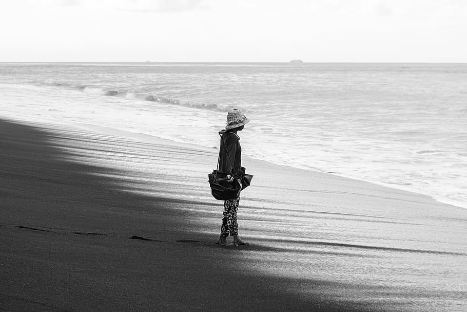 person standing on seashore, apparel, clothing, human, sun hat HD wallpaper