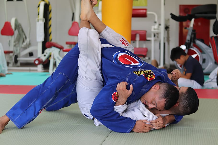 two men doing karate, lying down, males, indoors, child, full length HD wallpaper