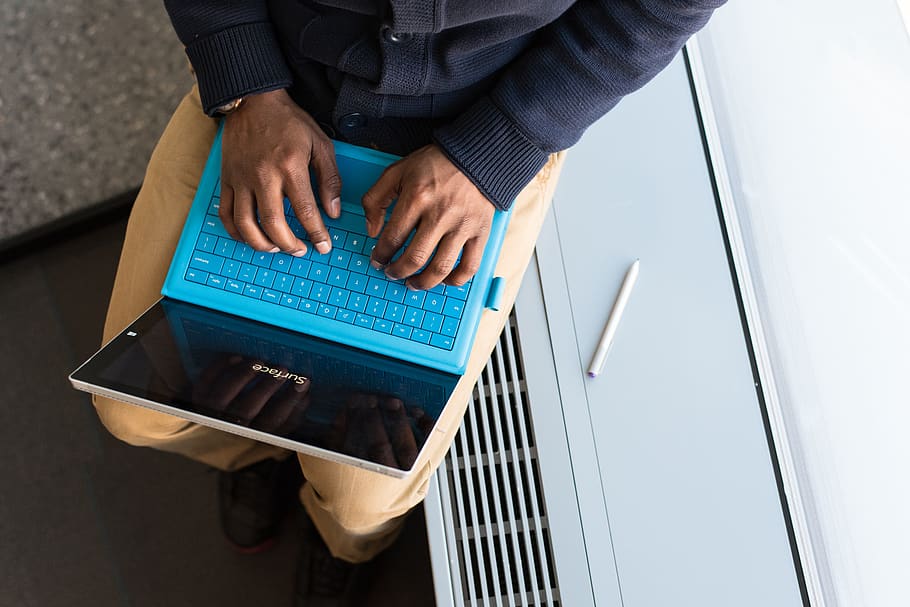 Person Typing on Blue Laptop Computer, close-up, electronics HD wallpaper