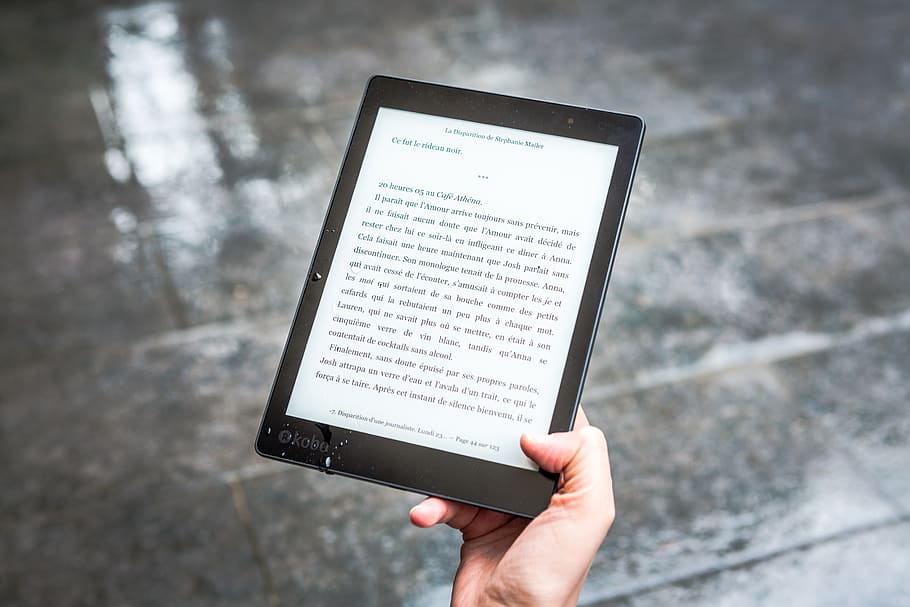 Person Holding Black E-book Reader, device, e-reader, ebook, electronics