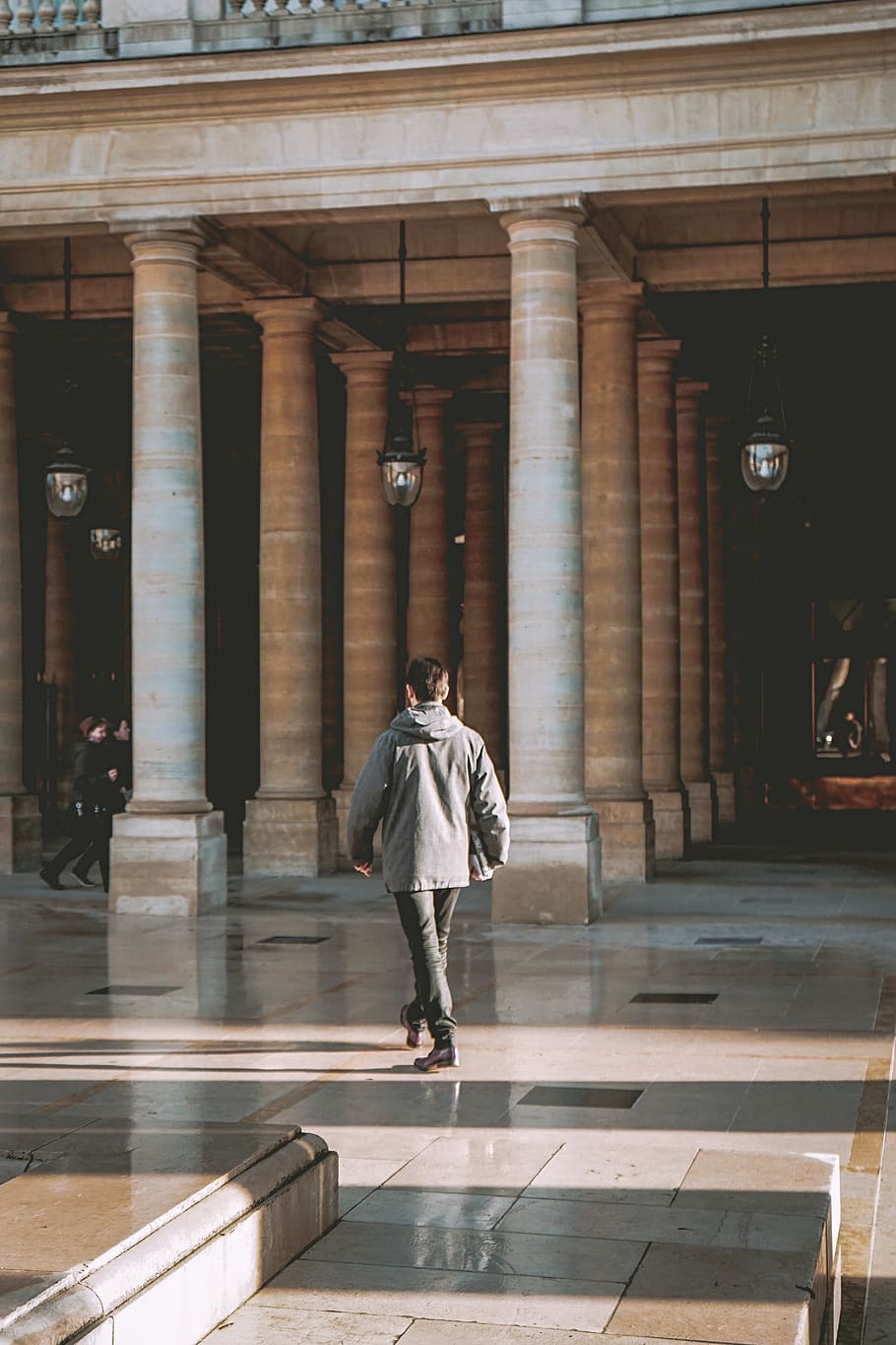 man walking beside concrete posts, apparel, clothing, human, person HD wallpaper