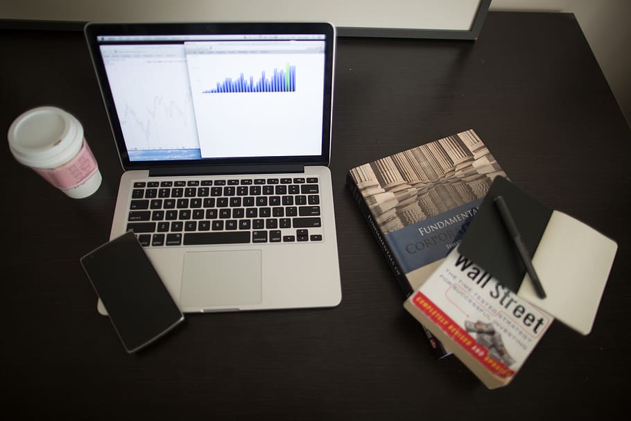 Macbook Pro on Table, books, charts, coffee, commerce, communication HD wallpaper