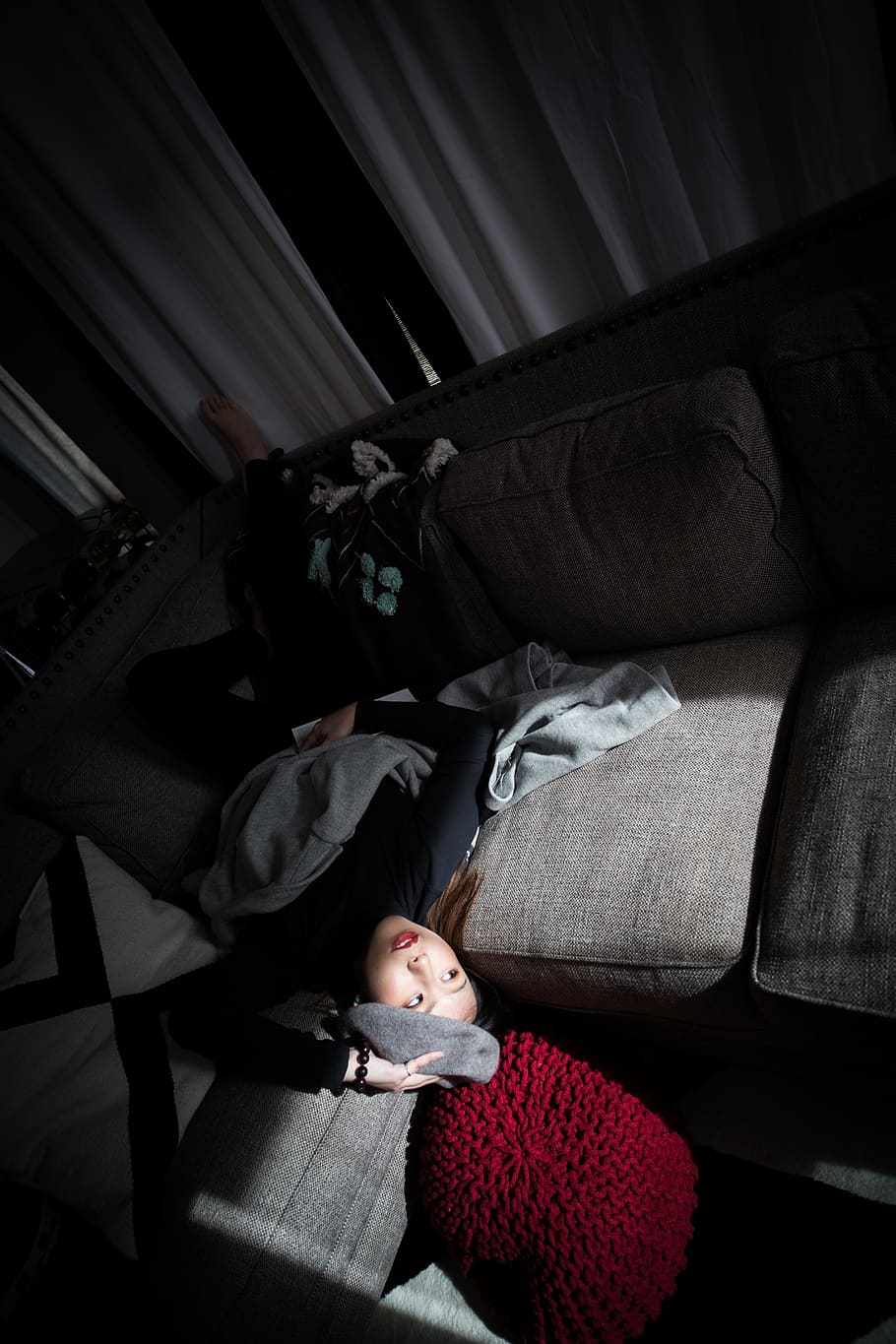 woman-lying-on-couch-near-window.jpg