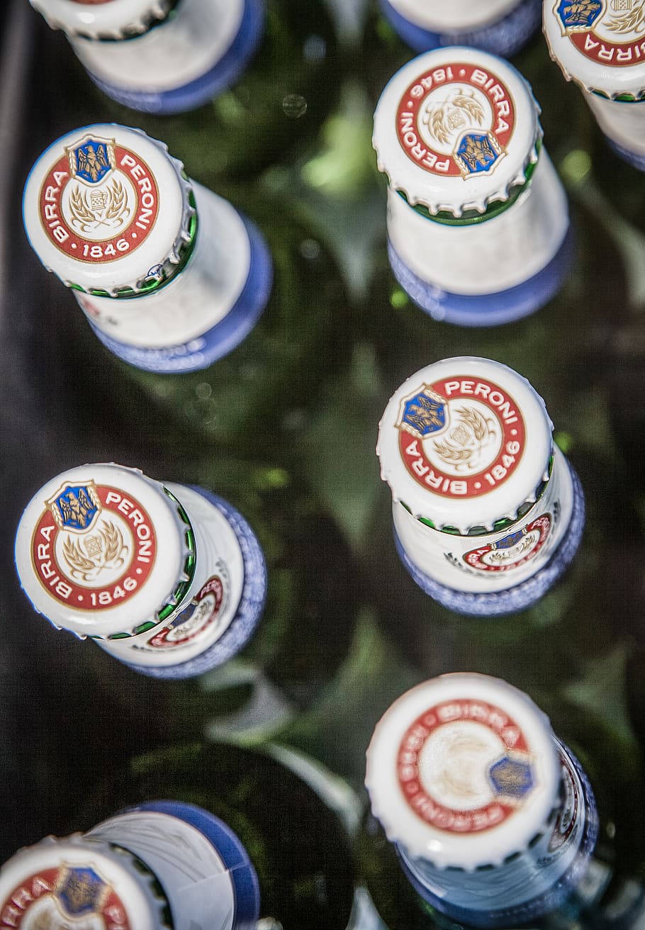 Peroni Birra drink bottle crowns, close-up, food and drink, no people
