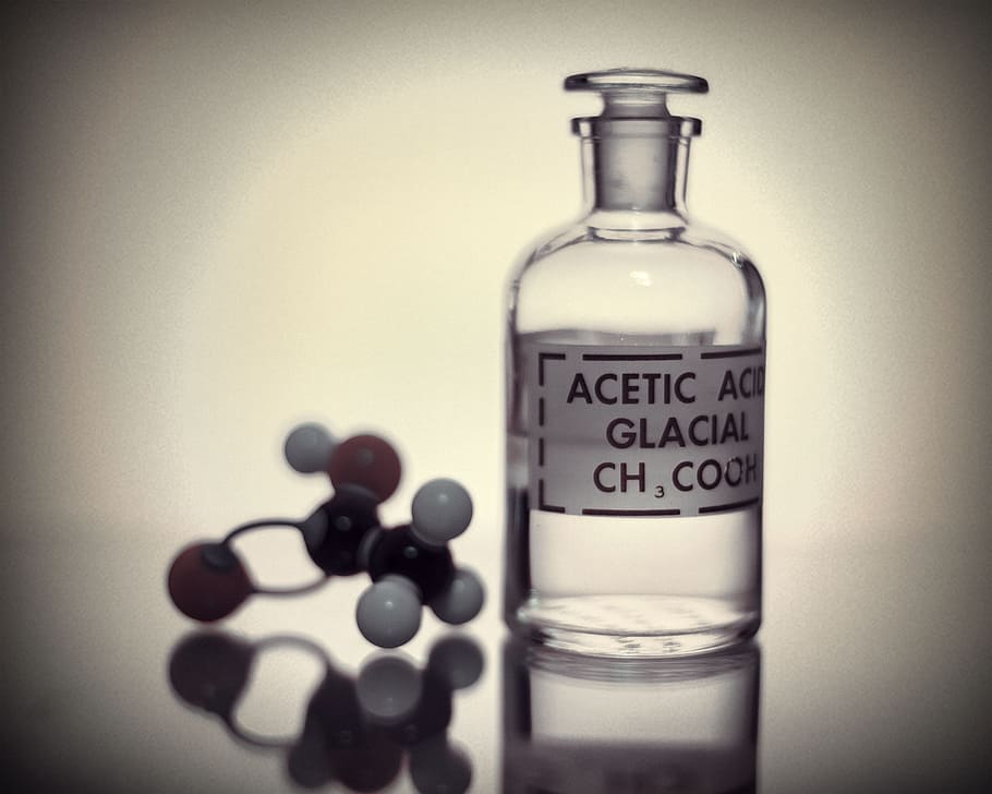 Bottle of acetic acid and the molecular structure., test, ph
