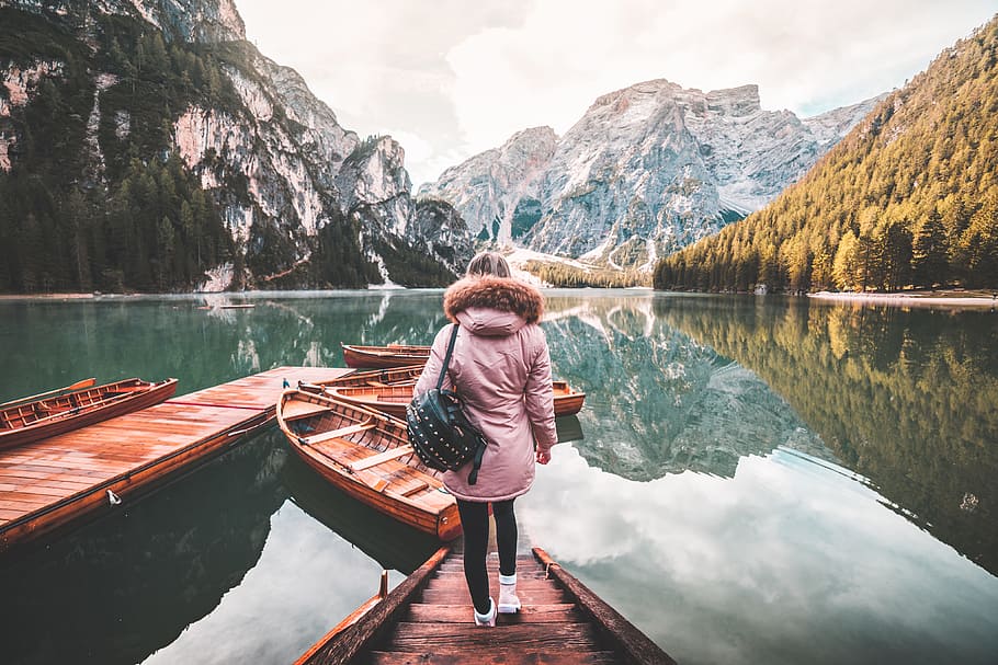 Young Woman Enjoying Beautiful Scenery of Lago di Braies, Italy