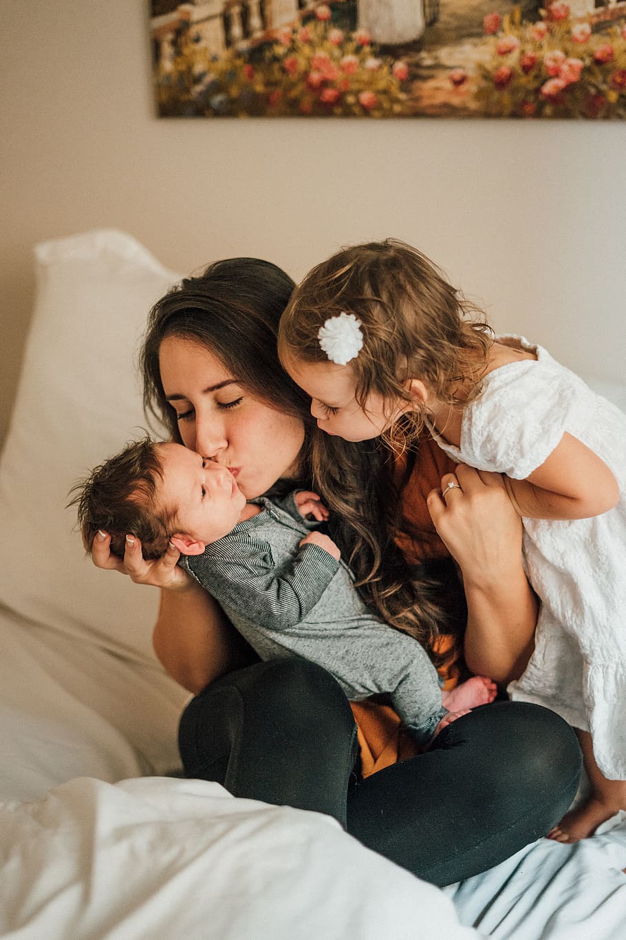 woman kissing baby wearing gray onesie, child, furniture, childhood