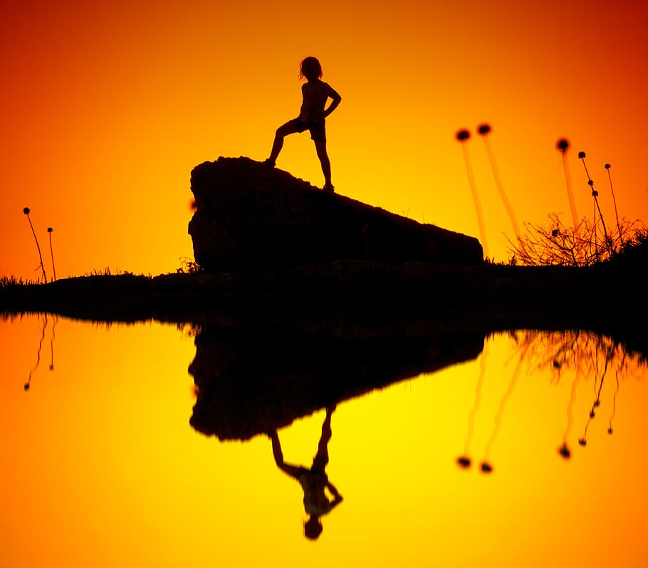 Silhouette of Child Standing on Rock, backlight, backlit, cliff HD wallpaper