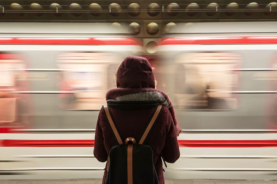 Standing Woman Facing a Speeding Train, adult, backpack, blur, HD wallpaper