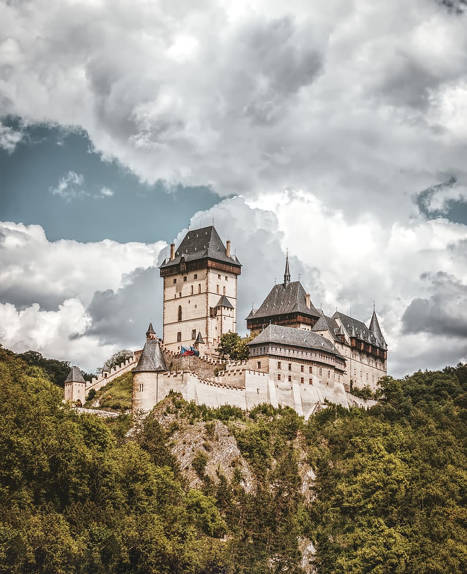 White and Black Concrete Castle on Mountain Under White Clouds HD wallpaper