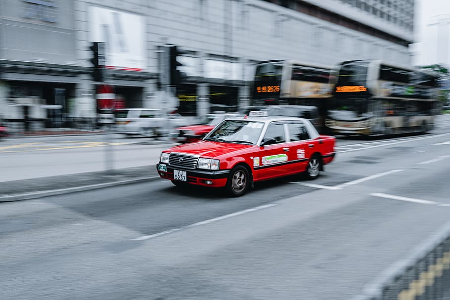 red car on road, vehicle, transportation, automobile, cab, taxi HD wallpaper