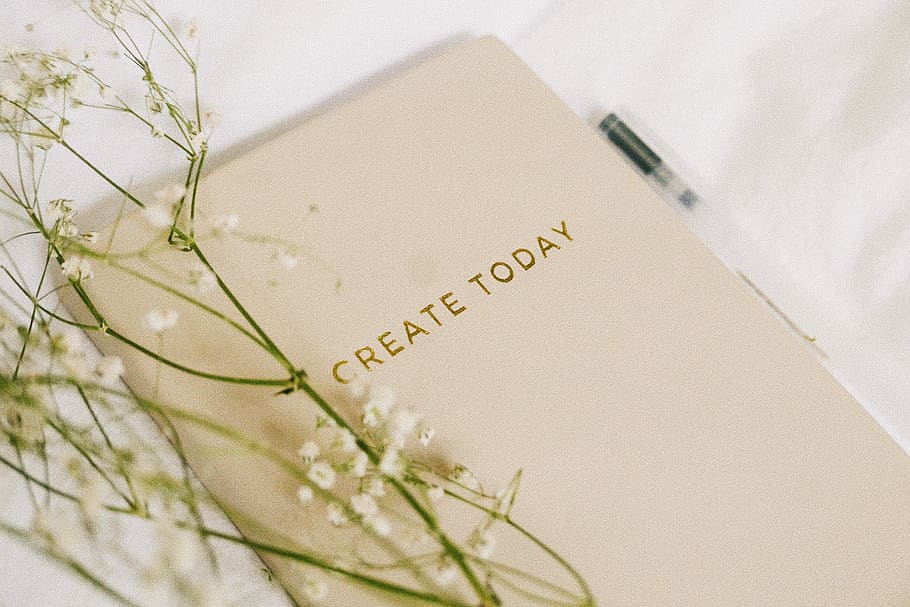 white flowers on book, text, western script, indoors, no people HD wallpaper