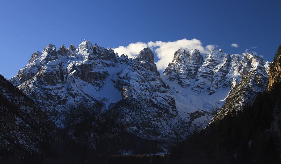 in distant photo of mountain range, outdoors, nature, peak, ice