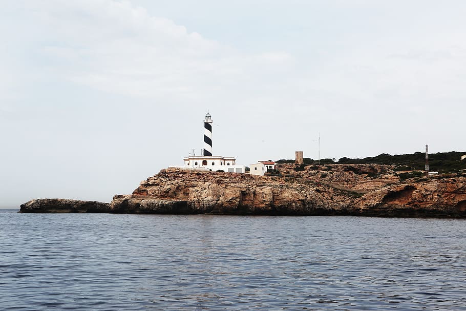 lighthouse, coast, sea, rocks, water, architecture, waterfront HD wallpaper