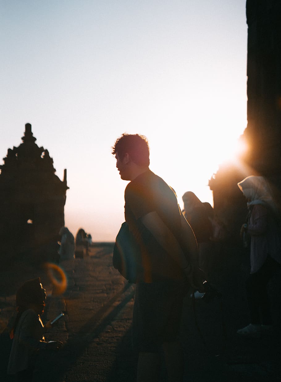 Selective Focus Photo of Man Standing in Front of Child, backlit HD wallpaper