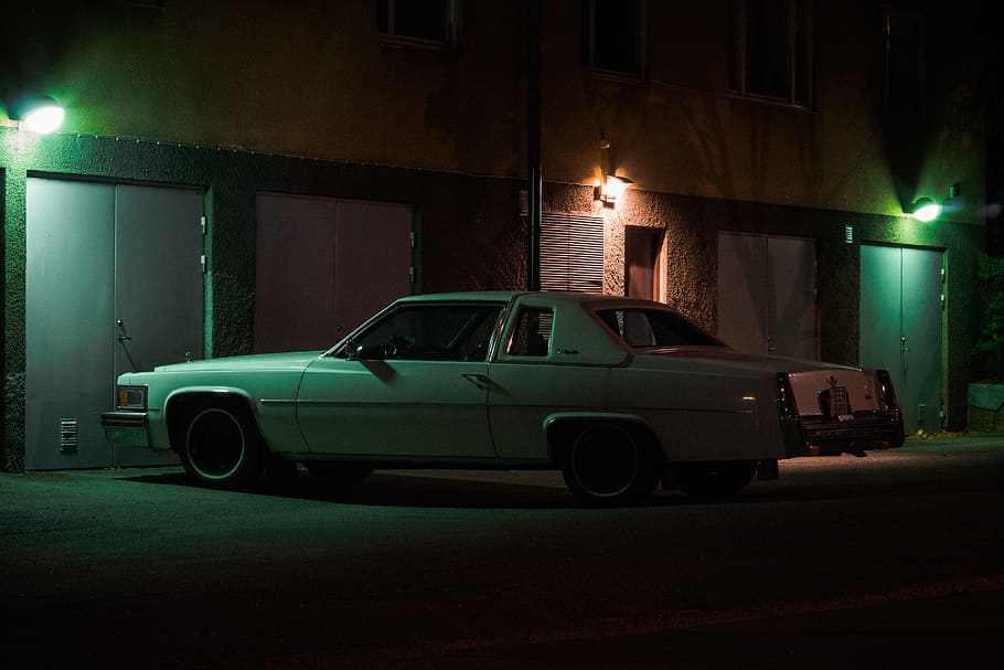 white car near commercial building, vehicle, night, street, cadillac